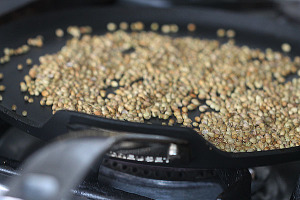 Roasting coriander seeds for garam masala