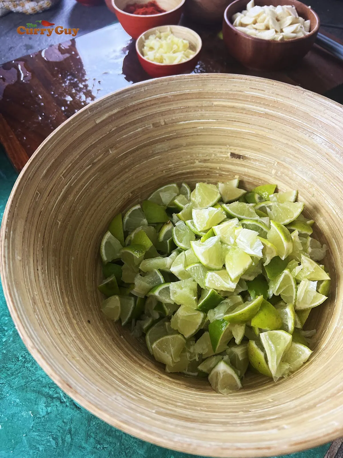 Chopped limes in mixing bowl.