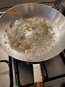 Frying garlic and ginger paste