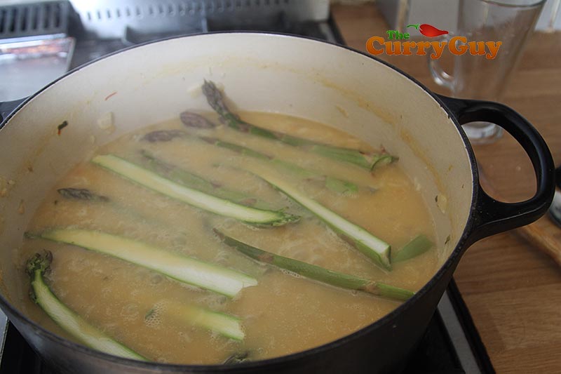 Adding asparagus