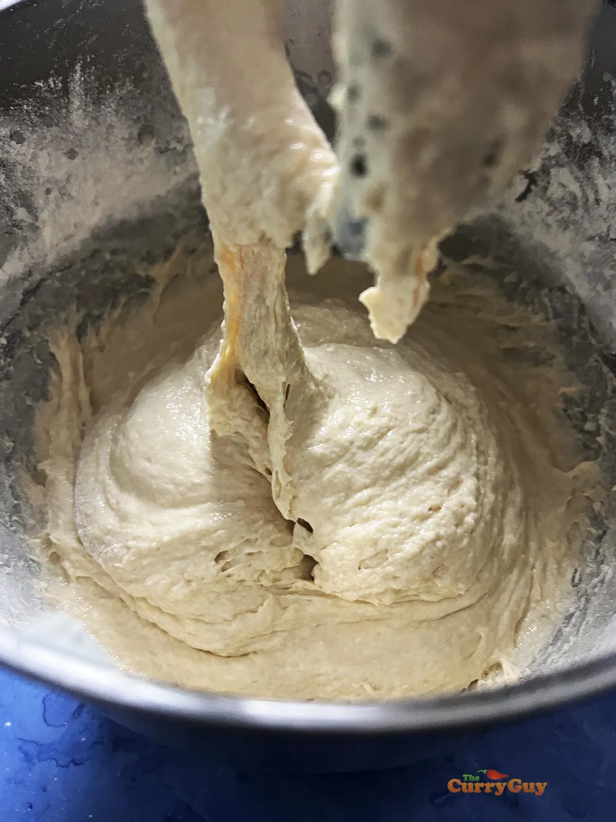 Mixing the wet dough together.