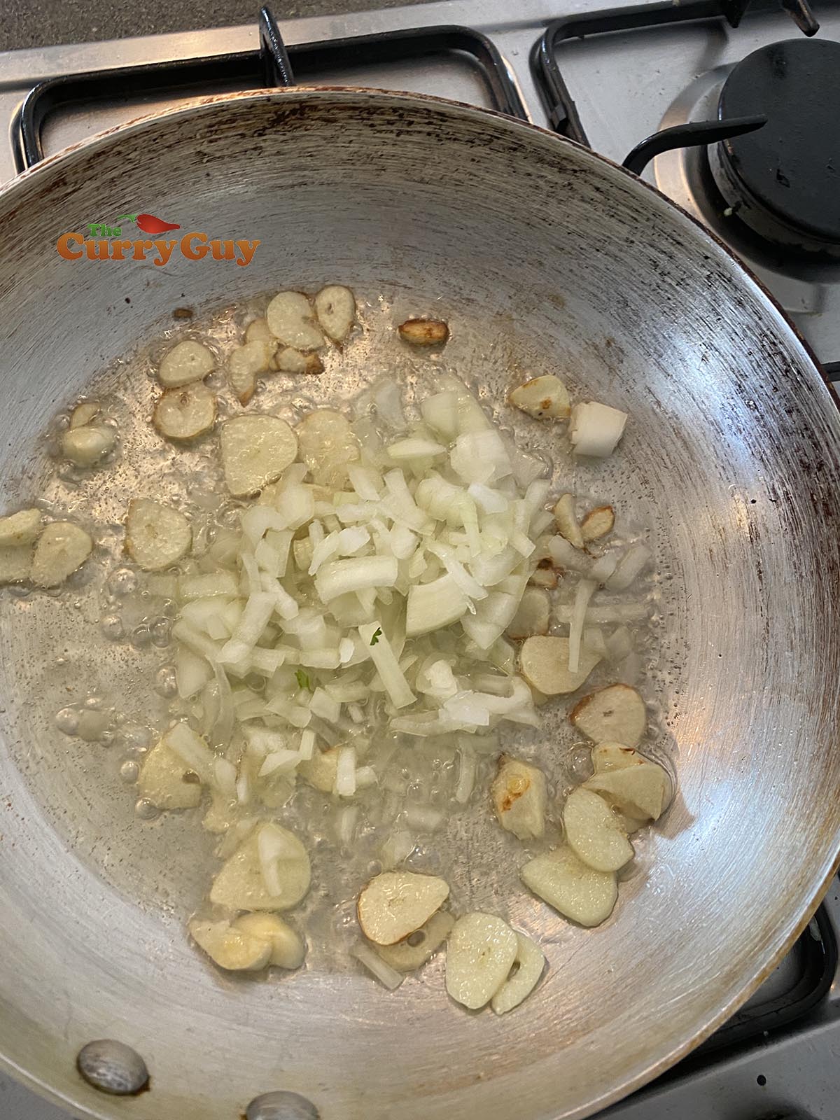 frying garlic slivers and onion