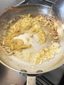 Adding garlic and ginger paste