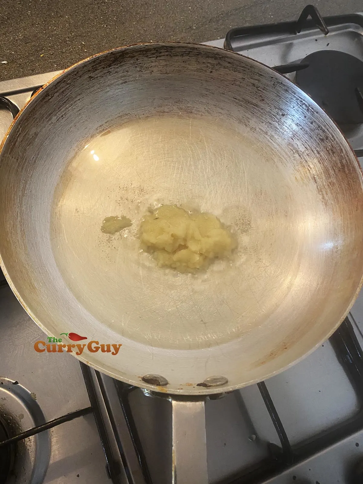 Frying garlic and ginger paste for Chicken Tikka Masala