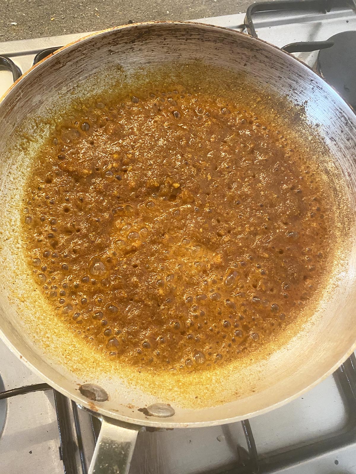 adding ground spices to the pan
