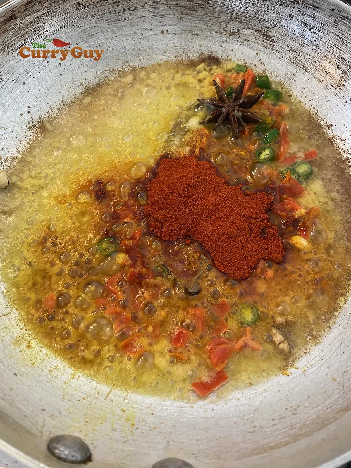 Adding chillies and ground spices