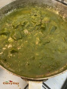 Adding kasoori methi (fenugreek) to the pan