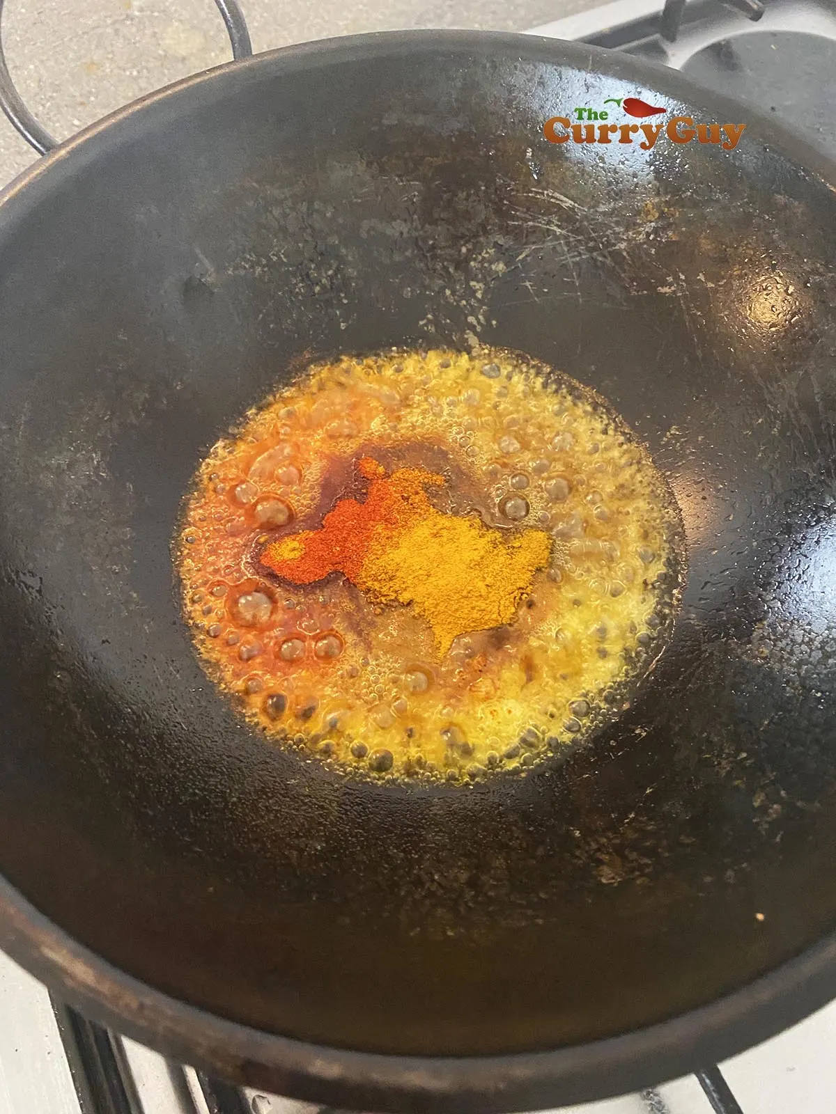 Adding spices to pan