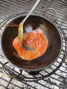 swirling in the tomato puree
