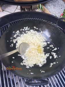 Adding onion to pan