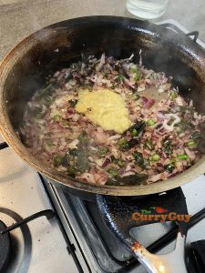 stirring in garlic and ginger paste