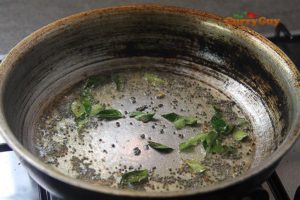 Frying mustard seeds and curry leaves
