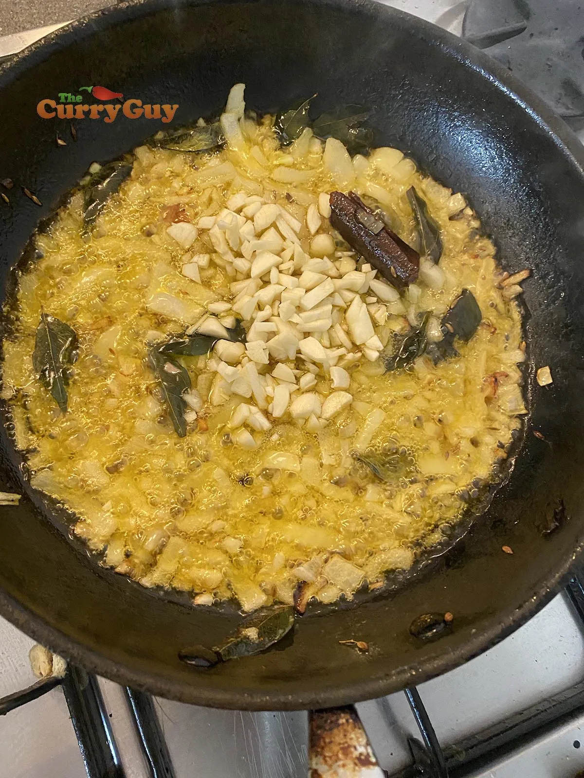 Adding garlic to the pan
