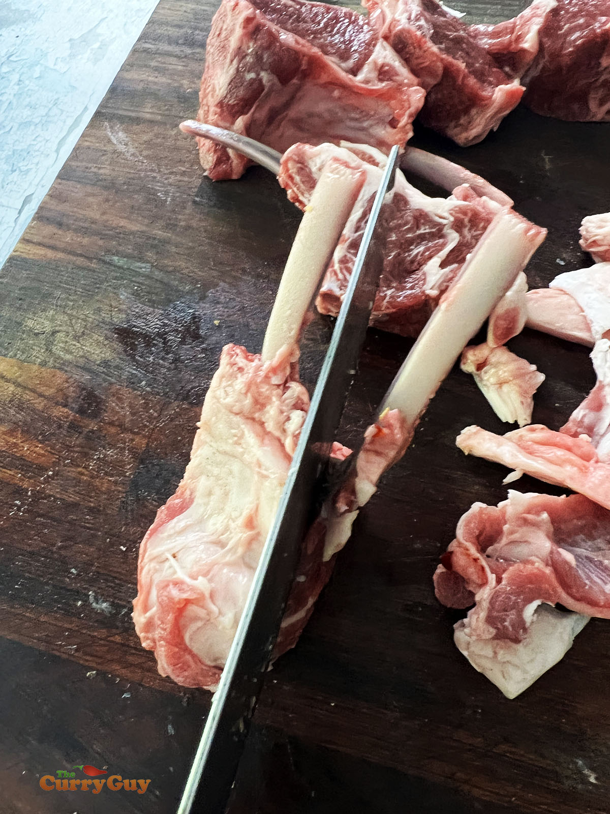 Slicing tandoori lamb chops.