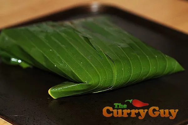 Salmon wrapped in a banana leaf for baking