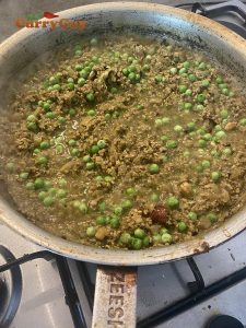 Adding the peas.