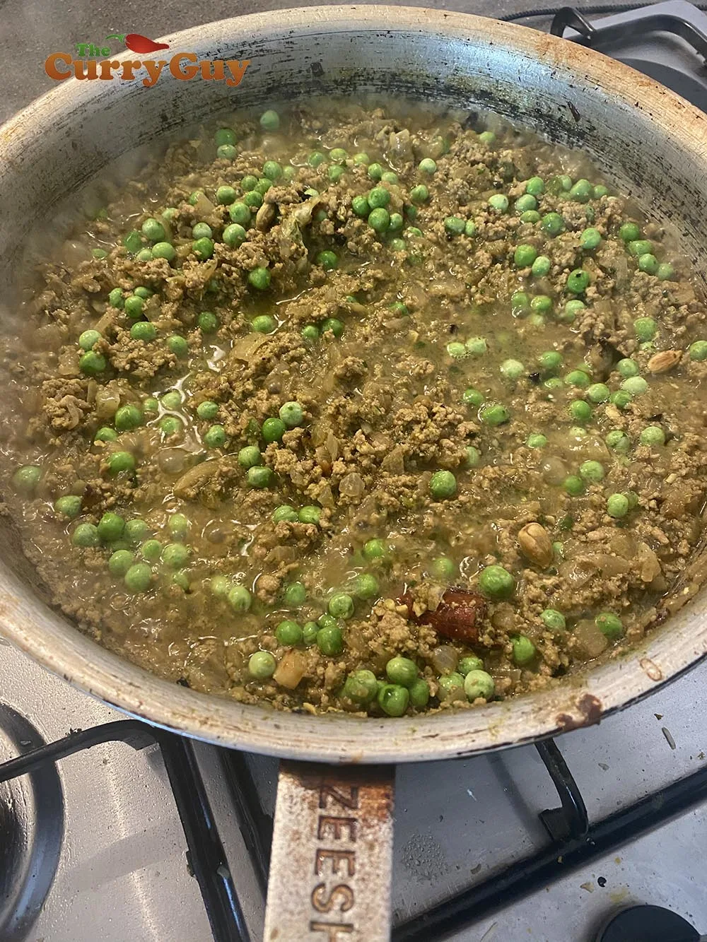 Adding the peas.