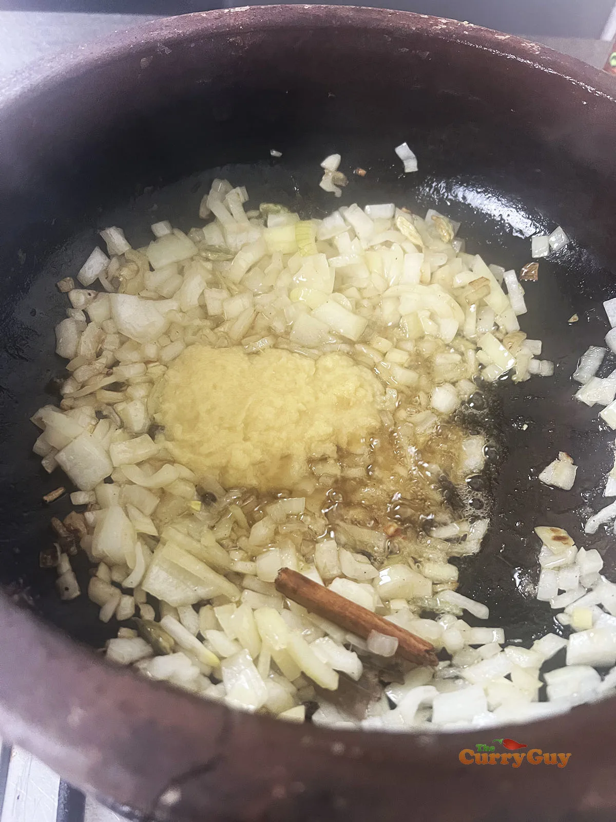 Frying onions and adding garlic and ginger paste.