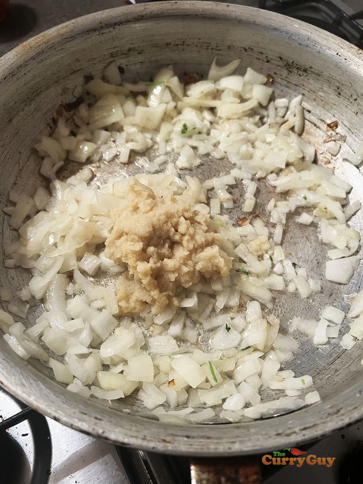 Frying onions, garlic and ginger in the pan