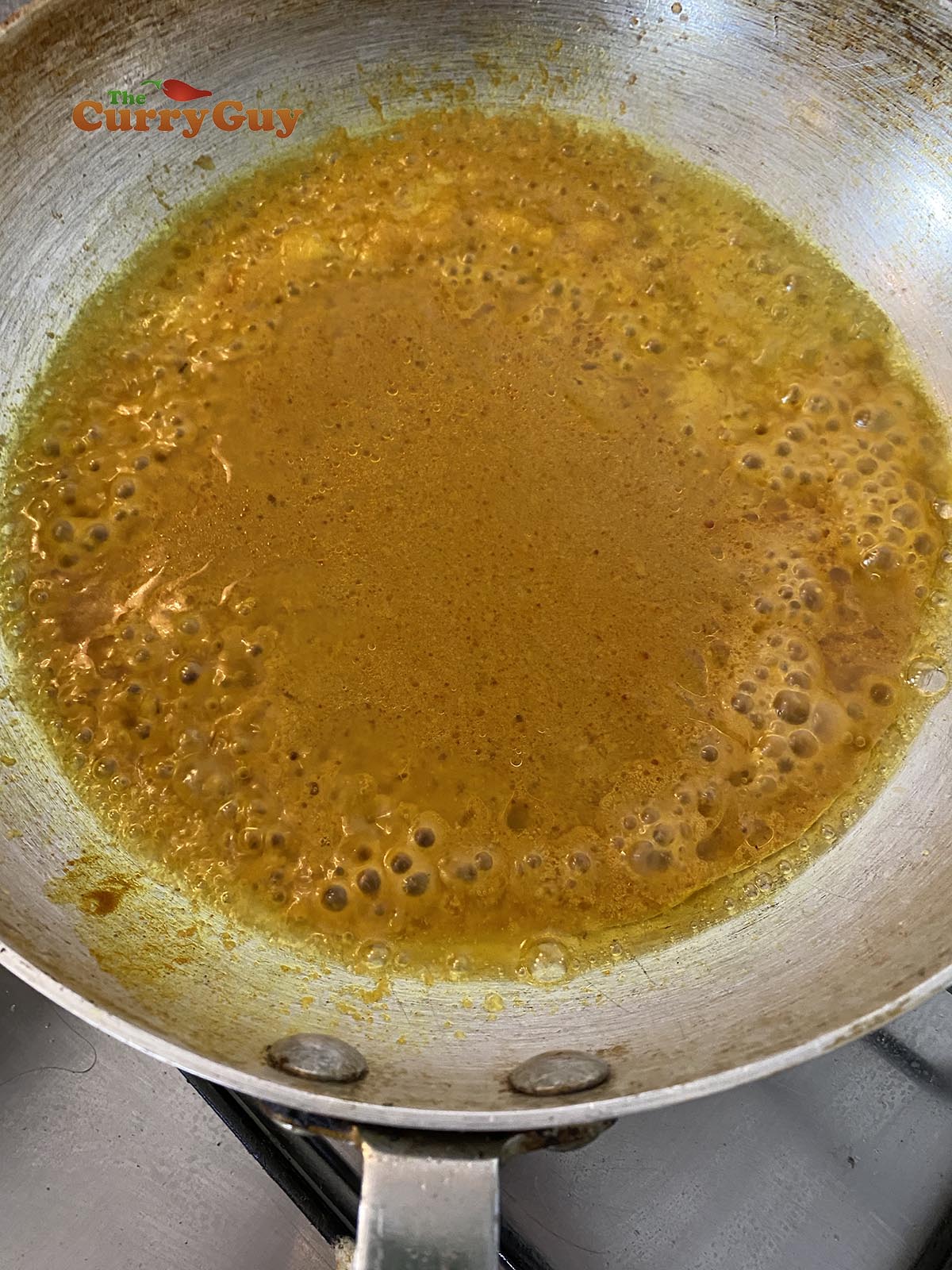 Adding base sauce to the pan