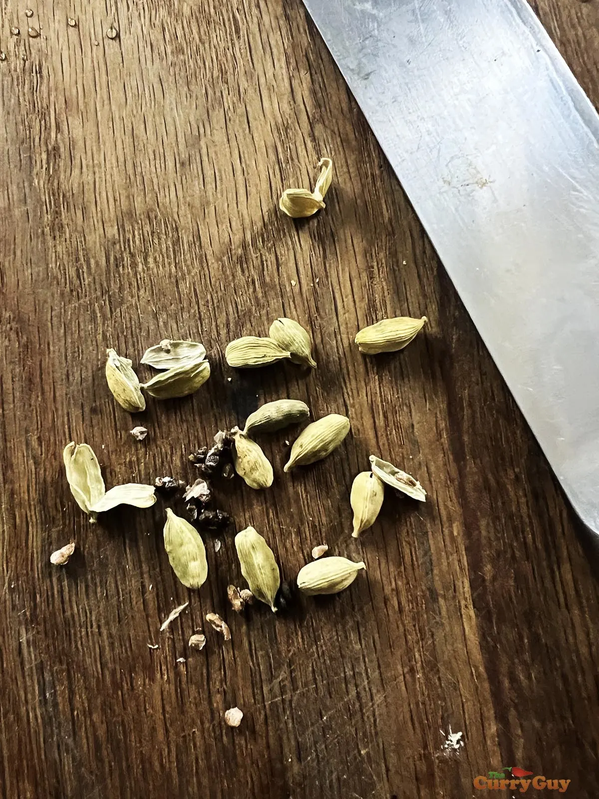 Removing the seeds from the cardamom pods.