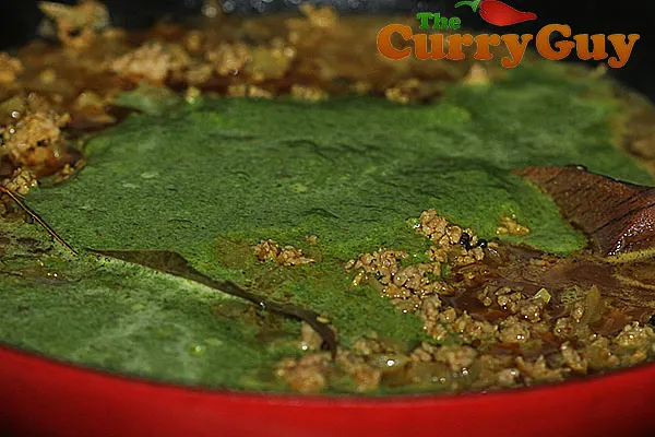 Adding spinach blend to lamb keema saag curry