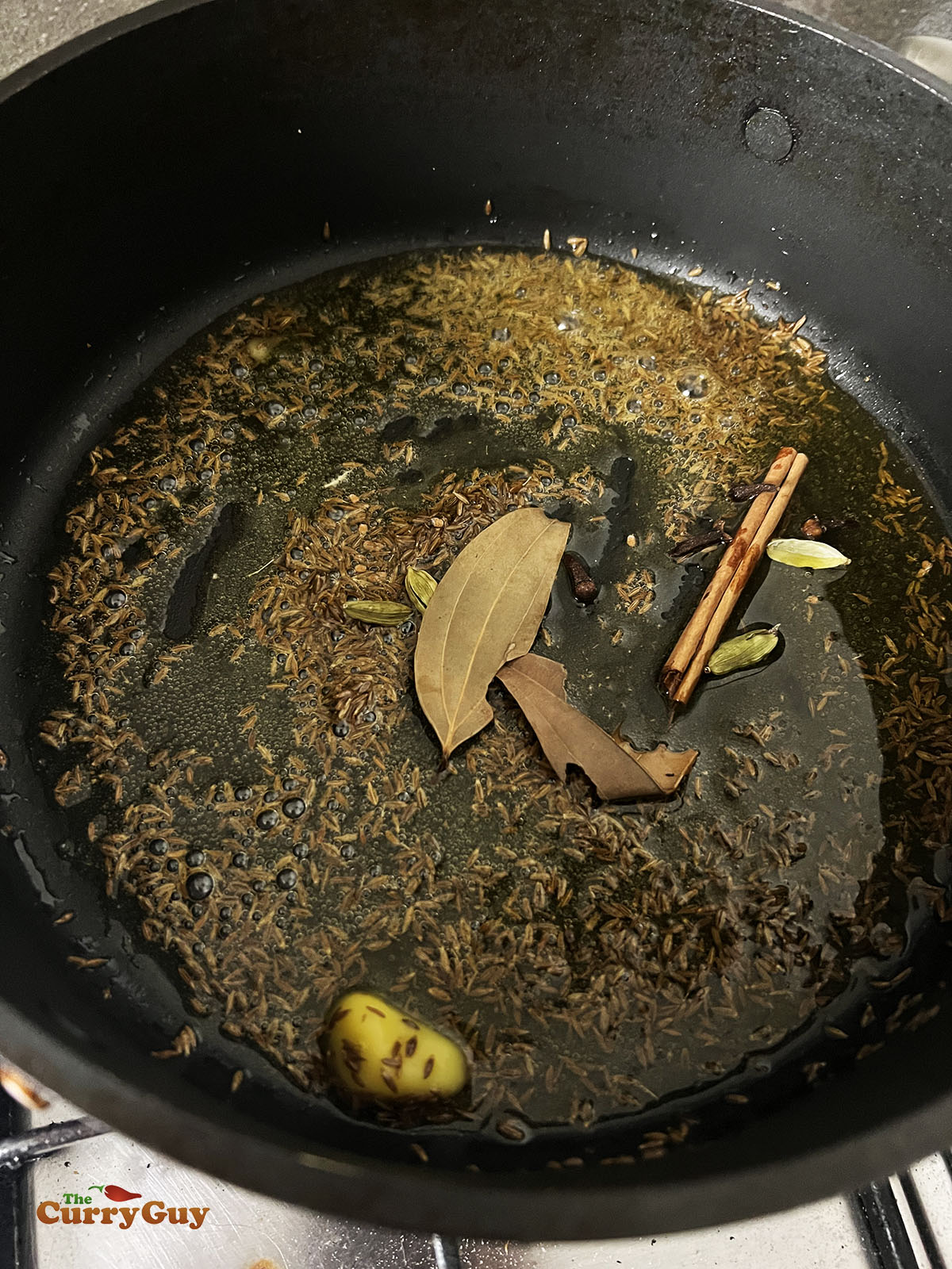 Infusing the spices in the ghee.