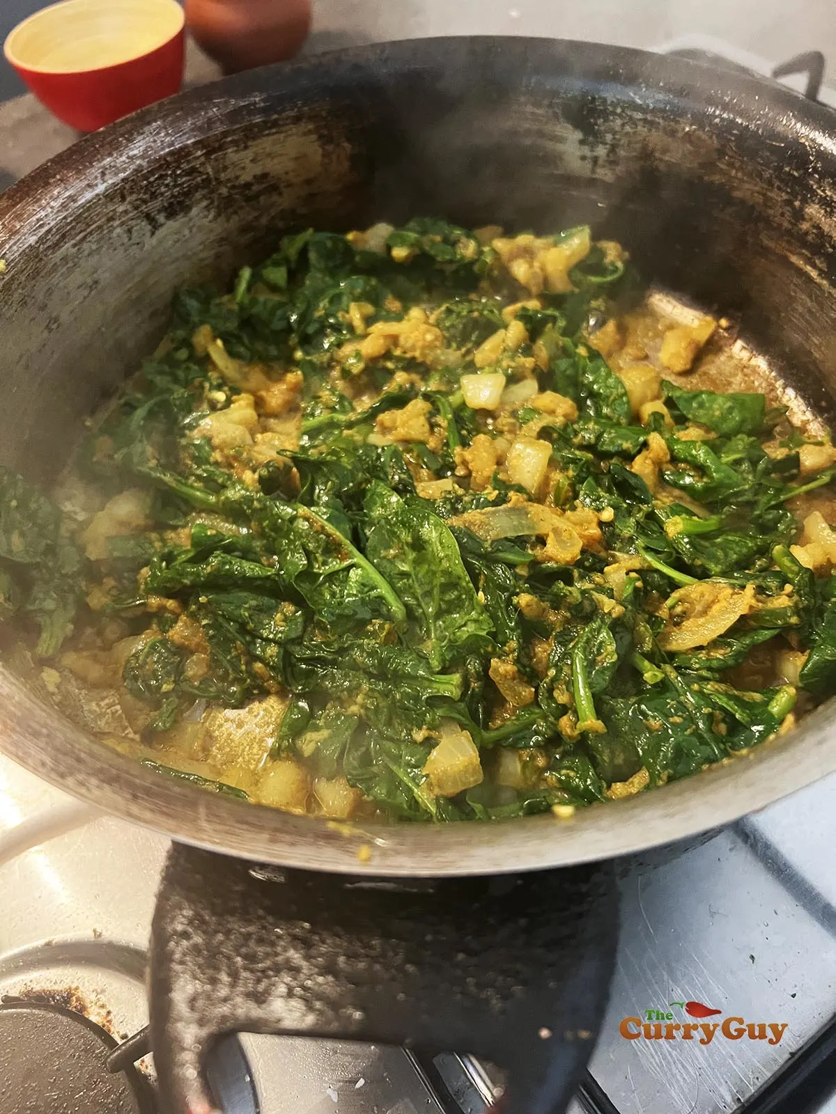 Spinach cooking in the pan