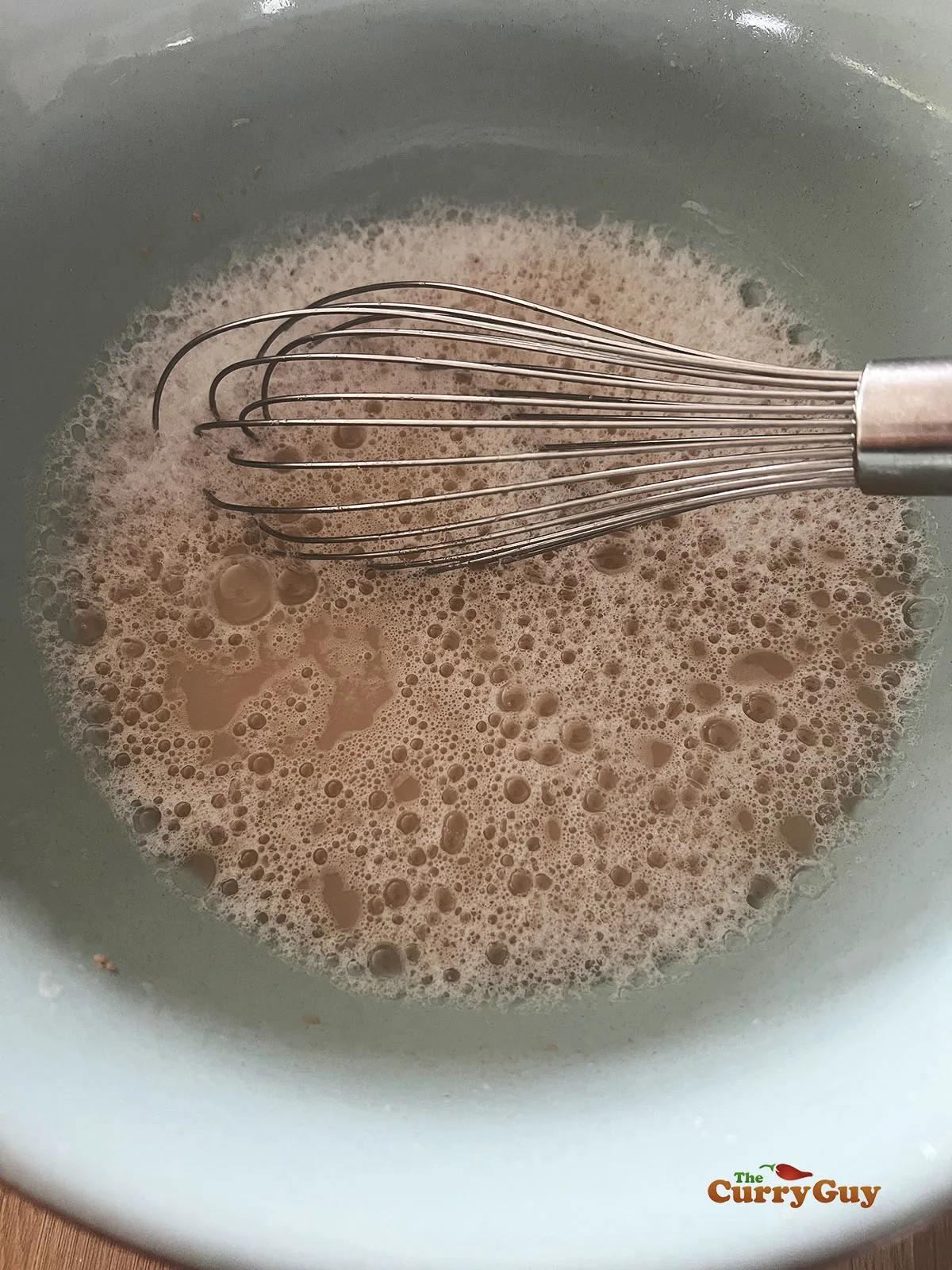 Frothy yeast, sugar and water mixture.