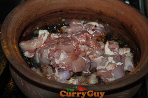 Making black chicken curry