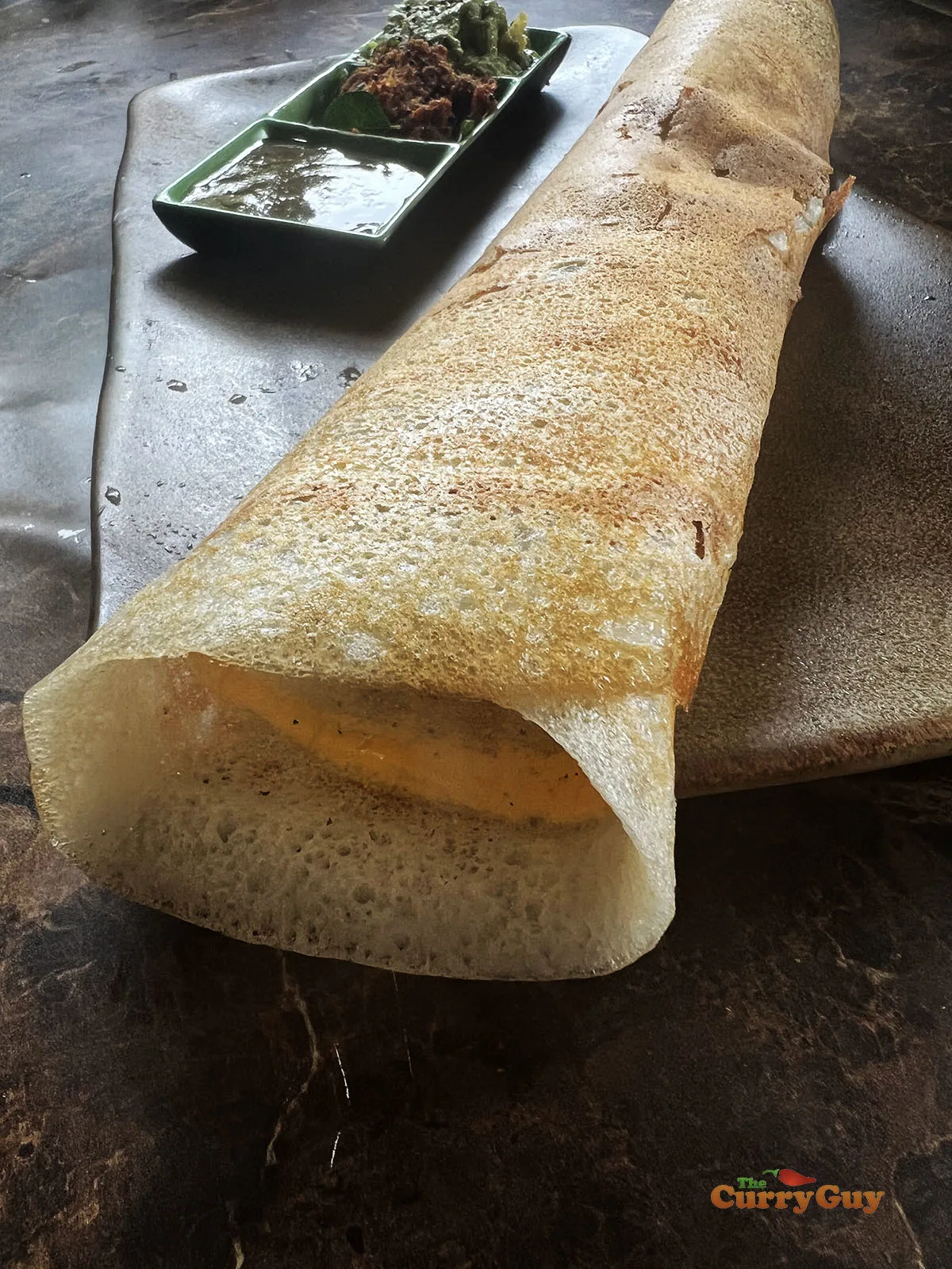 Egg dosa rolled up ready to serve.