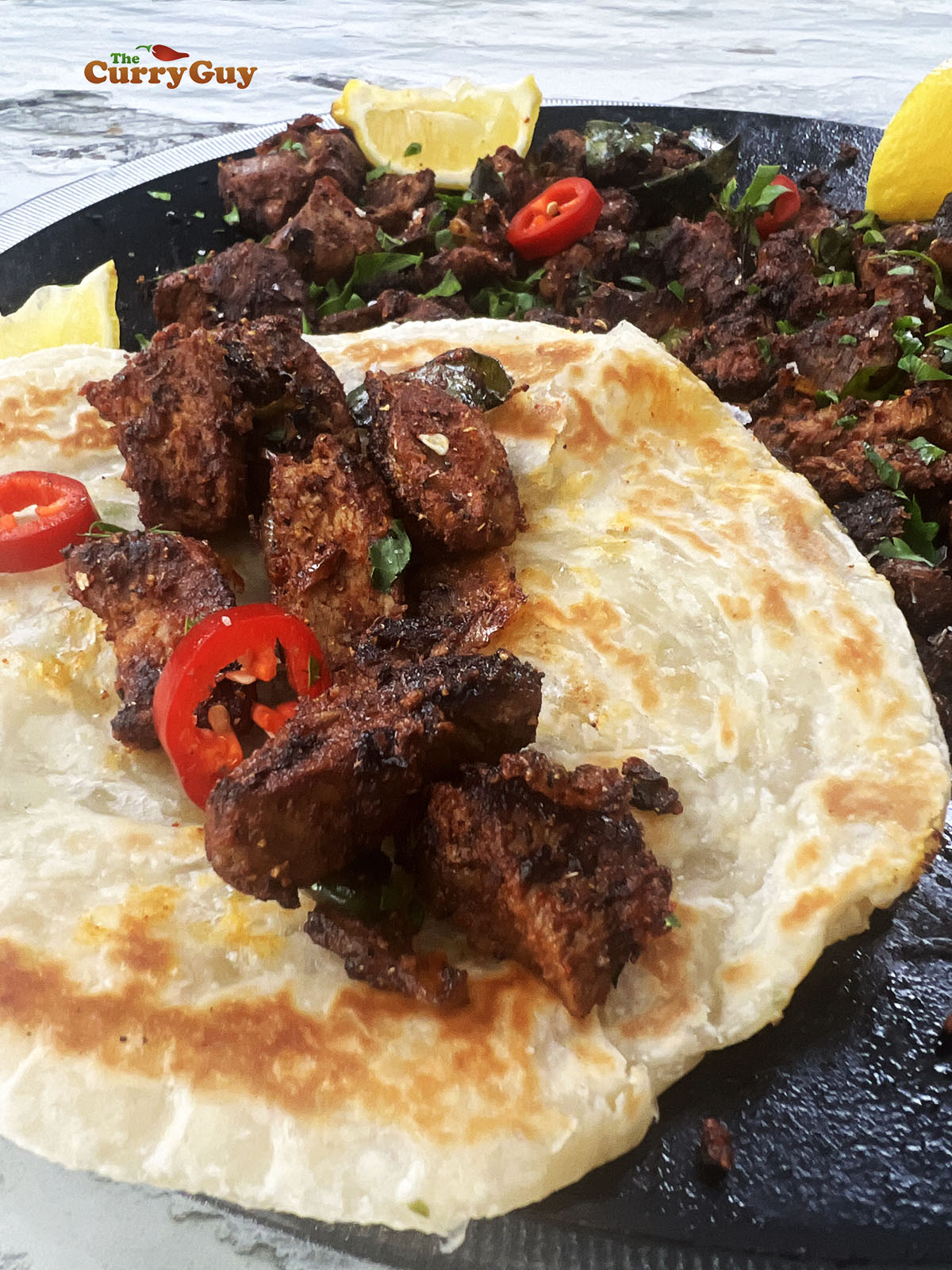 Lamb stir fry wrapped in a paratha