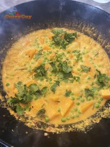 Butternut squash curry garnished with coriander (cilantro)