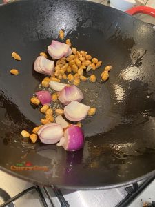 Frying onions and peanuts
