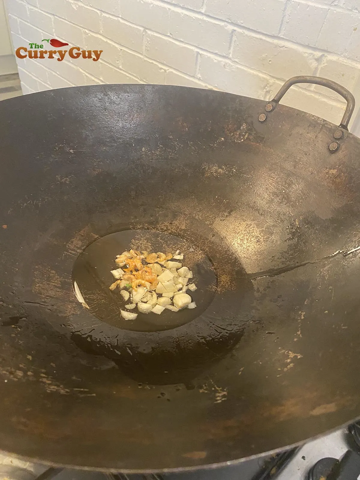 Frying garlic and shrimp.