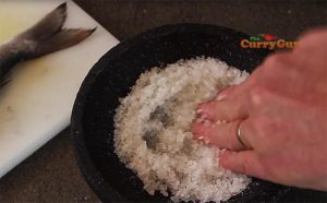Salting the Thai salt crust fish