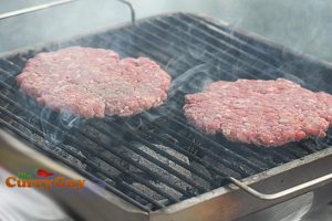 flame grilling burger patties