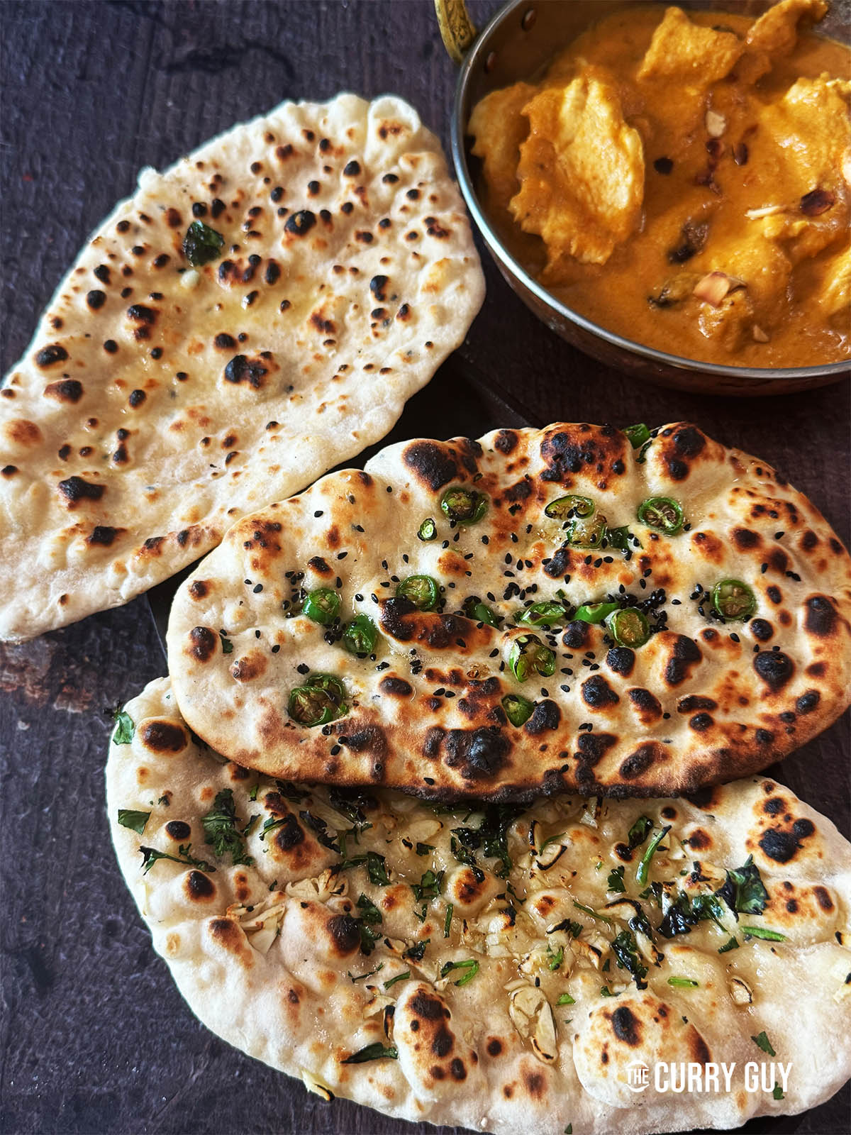 Naans Cooked in a pan served on a plate