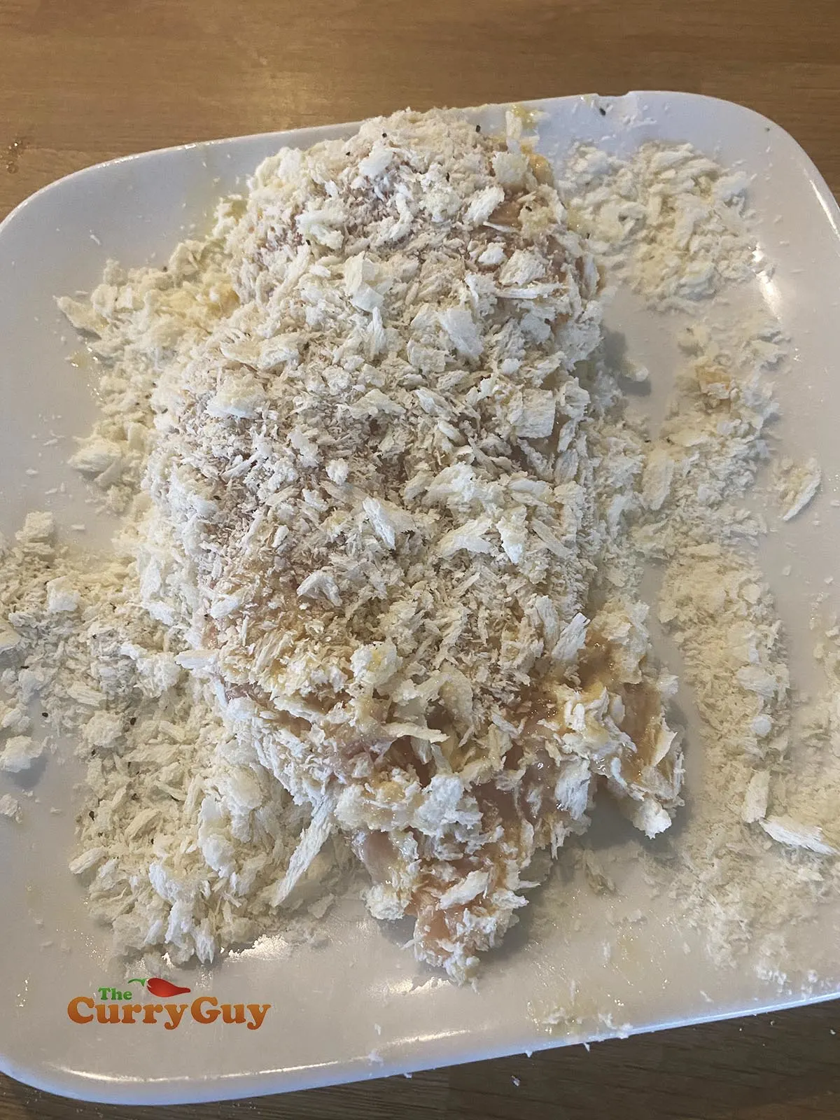 Coating chicken with bread crumbs