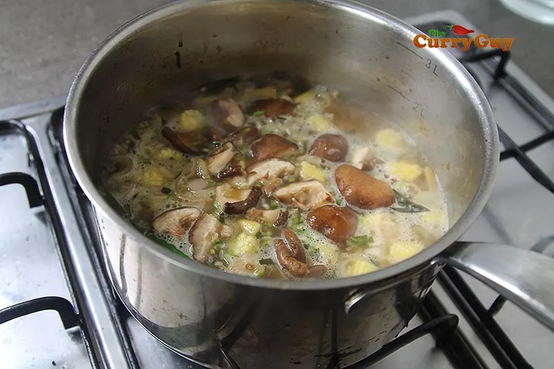 making Thai soup with prawns