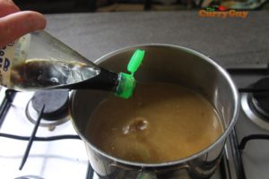 Making Thai hot and sour prawn soup