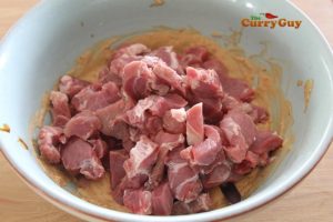 Adding meat to marinade