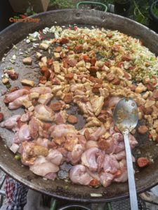 adding meat to traditional paella