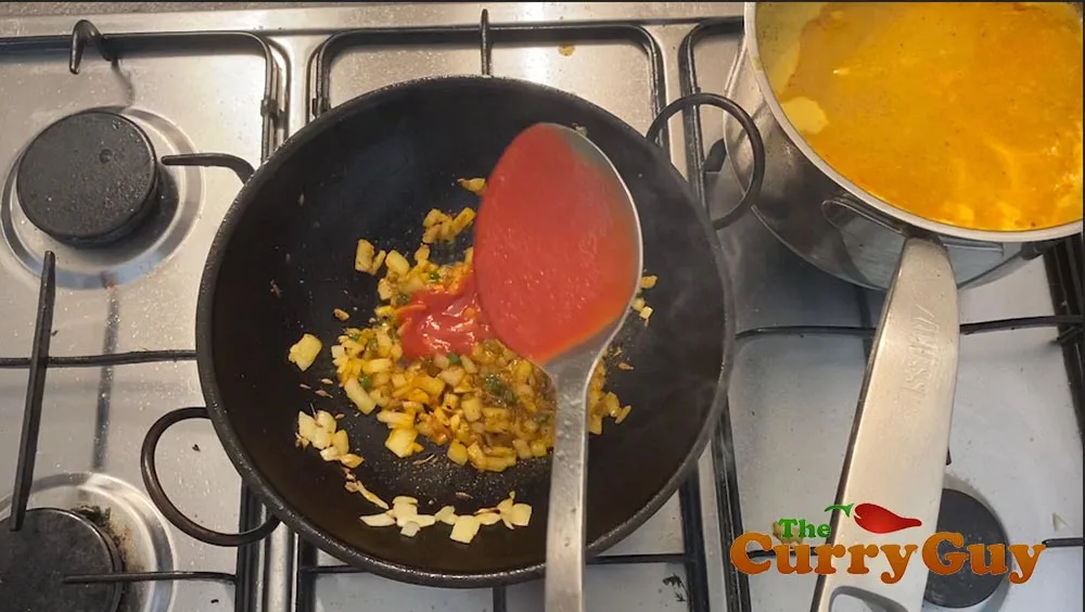 Adding tomato puree