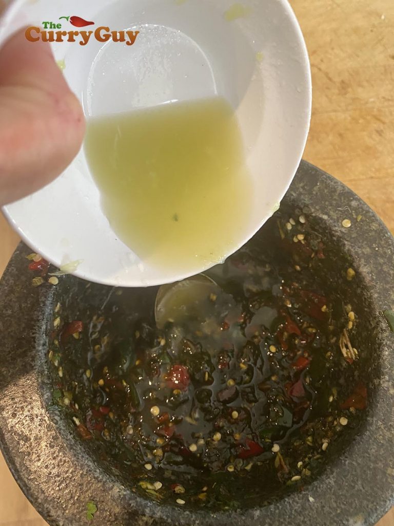 Adding lime juice to the sauce