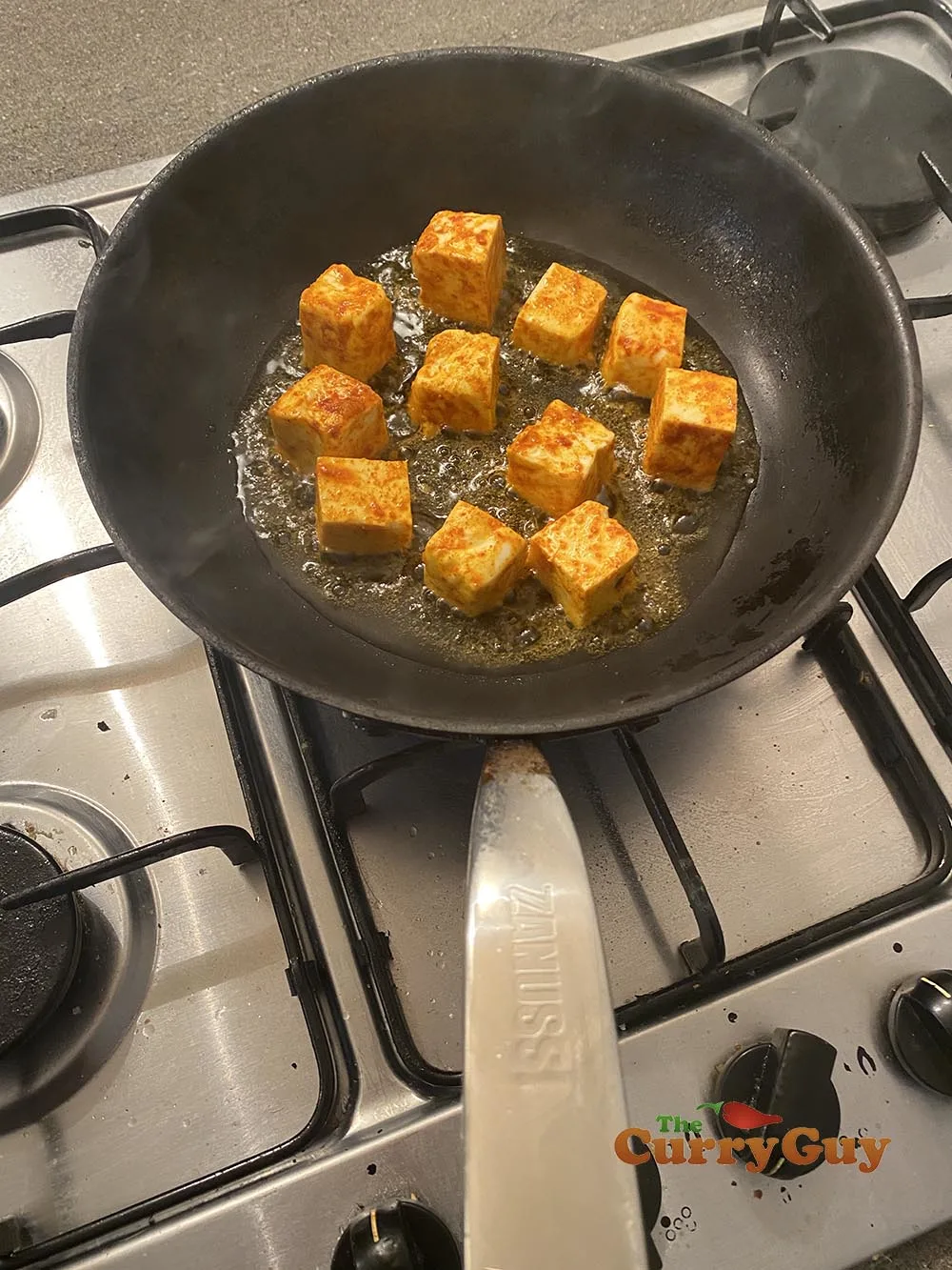 frying cubed paneer