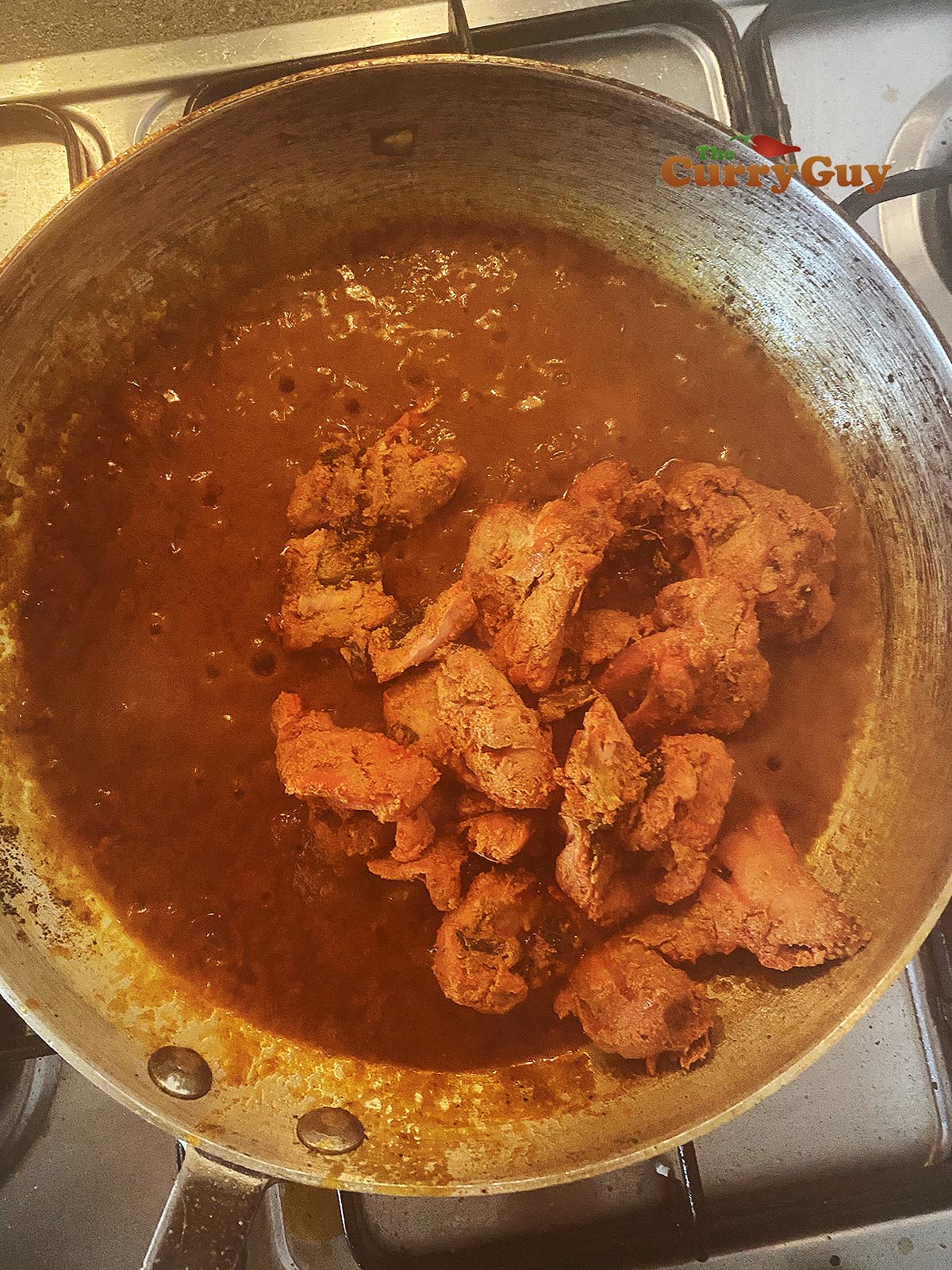 Adding tomato puree, base sauce and chicken