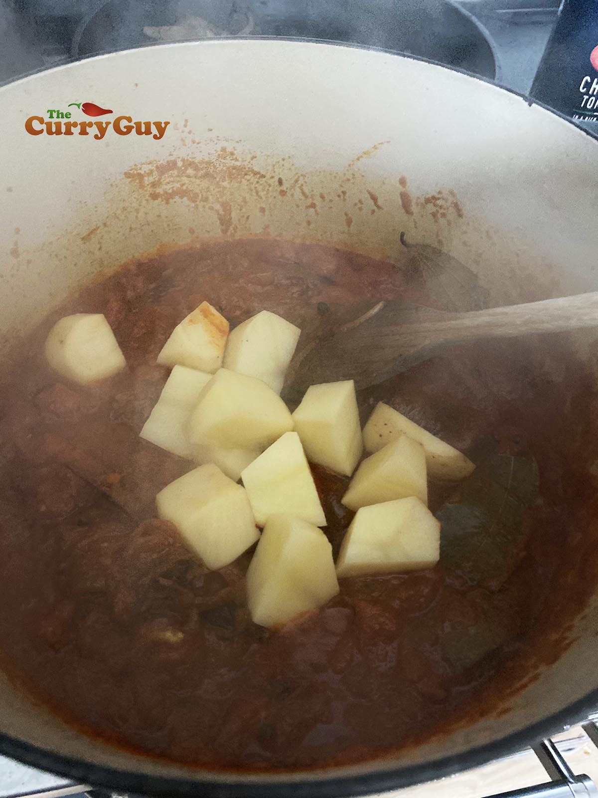 Adding potatoes to the pan