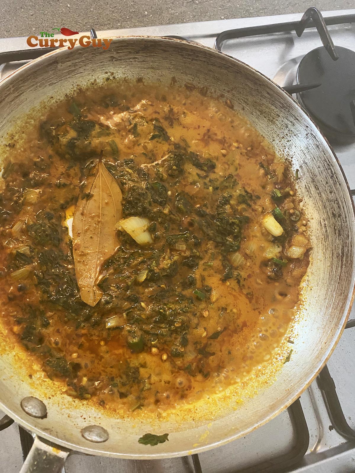 Adding base sauce to pan.