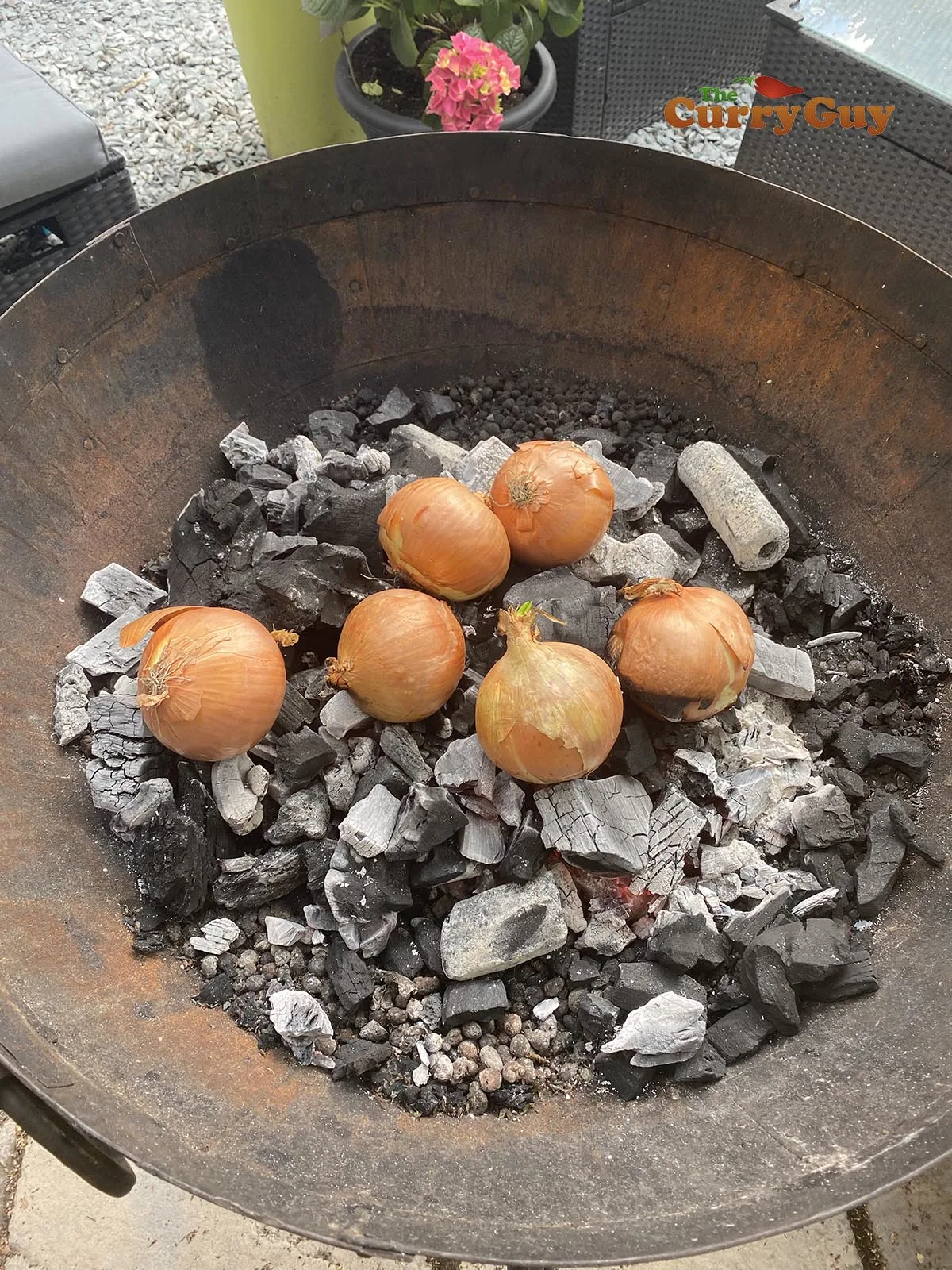 Roasting onions in the bbq embers